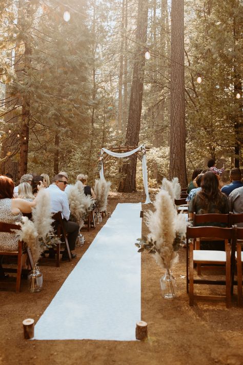 Wedding Seats Outside, Forest Wedding Aisle Runner, Dried Floral Aisle Decor, Diy Wedding Ceremony Seating, Dirt Wedding Ceremony, Wood Wedding Ceremony, Small Woods Wedding Ceremony, Farm Tables Wedding Reception, Woodsy Boho Wedding