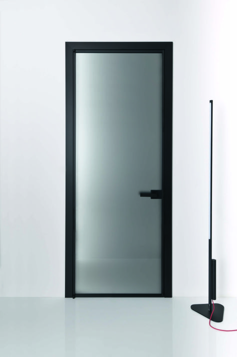 A complete system for configuring spaces without giving up the transparency of glass   The Prima system is characterised by a minimal, rectangular profile. It is ideal for creating large size movable walls and panels, while maintaining clean lines with single glazing. This complete system satisfies multiple design needs, from a classical hinged or pocket door, through to large sliding panels.#Swingdoor #hingeddoor #albed #albedmilano #madeinitaly #design White Door Black Frame, Bathroom Door Ideas Modern, Black Bathroom Door, Bathroom Door Ideas, Black Profile, Sliding Doors Exterior, Movable Walls, Stained Glass Door, Glass Hinges