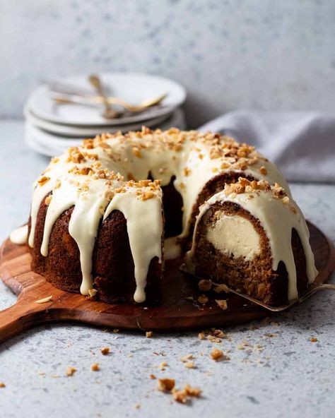 Cheesecake stuffed carrot bundt cake on a platter ready to be served Cheesecake Stuffed Carrot Cake, Stuffed Bundt Cake, Cheesecake Carrot Cake, Carrot Cake Bundt, Cheesecake Bundt Cake, Carrot Bundt Cake, Carrot Cheesecake, Cheese Block, Powder Cake