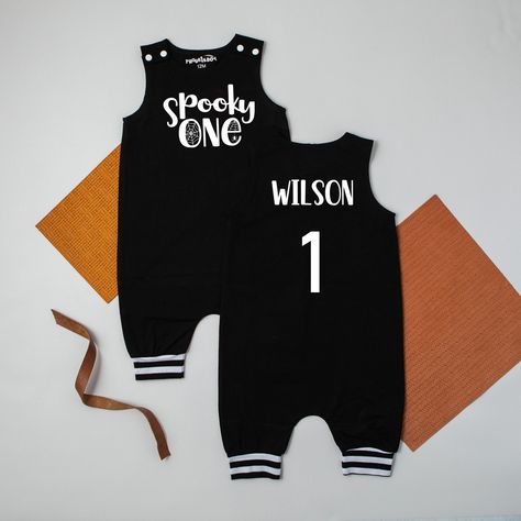 Spooky One 1st Birthday Spiderweb Themed Personalized Birthday Romper! * Available in 6 month, 9 month, 12 month, 18 month, and 24 month/2T sizes. * Black Romper with black and white cuffs  (Cuffs on rompers are meant to hit just beneath the knee) * Snaps at each shoulder for easy on and off.  Please note there are no snaps at the leg, to change a diaper the romper will need to be unsnapped at the shoulder. You may choose to add your child's name to the back as well as the number "1" (these come together) Please make sure to leave your child's name in the personalization box at checkout. Sizing information: Available in the 2nd picture in the listing   Please. please, please check measurements to ensure proper size.  The amount of stretch is less than an the average bodysuit. The best way Halloween First Birthday Boy, Spooky One First Birthday Boy, Halloween First Birthday, Birthday Romper, Birthday October, Boys First Birthday, Spooky One, First Birthday Outfit, First Birthday Outfits