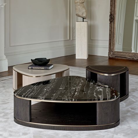 Elevate your living space with our Jenny coffee table trio, a statement arrangement designed for larger rooms. This cluster of three tables varies subtly in shape and height, offering both visual interest and versatile functionality. Choose from a variety of finishes to match your décor, with the option to top one or more tables with luxurious marble. This dynamic grouping invites creativity in layout and styling, making it the perfect centrepiece for spacious interiors. Whether used together fo Coffee Table Set Of Three, Baxter Coffee Table, Luxury Center Table, Statement Arrangement, Center Table Design, Centre Tables, Centre Table Living Room, Top Sofas, Center Table Living Room