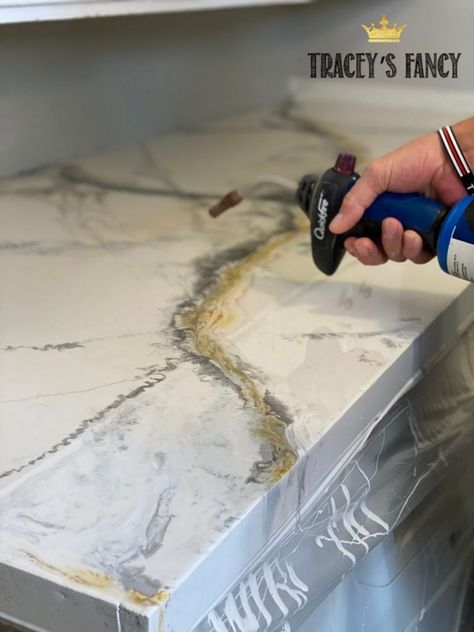 How to pour an epoxy countertop...and more laundry room updates Tracey's Fancy White Epoxy Countertop, Diy Epoxy Countertop, Faux Marble Countertop, Inexpensive Countertops, Laundry Room Update, Paint Stir Sticks, Silver Spray Paint, Resin Countertops, Kitchen Ideals