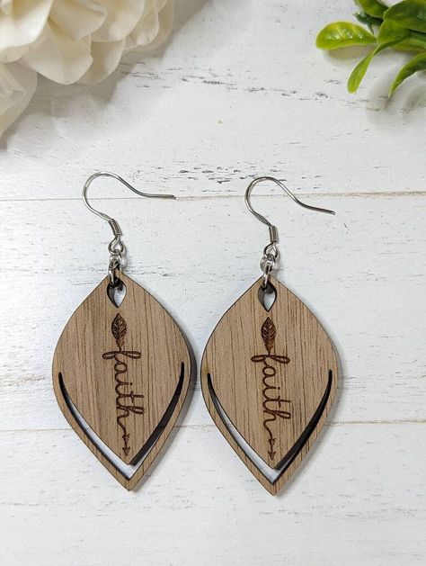 "A great gift for the person that you love. These inspirational earrings will bring encouragement, faith, hope and love. Measurement: height 1.75\" x width 1\". Total height with wire hook 2.5\". All my jewelry is made by me in my home studio. Please feel free to message me with any questions you may have." Wood Engraved Earrings, Handmade Wooden Earrings For Everyday, Natural Wood Earrings For Gifts, Teardrop Wood Earrings For Gifts, Laser Earrings, Laser Jewelry, Nature-inspired Natural Wood Earrings For Gift, Laser Engraved Earrings, Glowforge Ideas