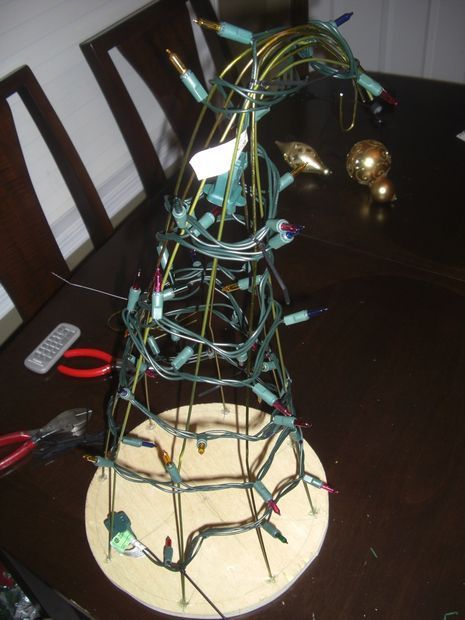 make a grinch tree w/wire coat hangers and a plywood circle Grinchmas Tree, Make A Grinch, Grinch Tree, Christmas Parade Floats, Wire Coat Hangers, Elf Christmas Decorations, Grinch Decorations, Grinch Trees, Grinch Christmas Party