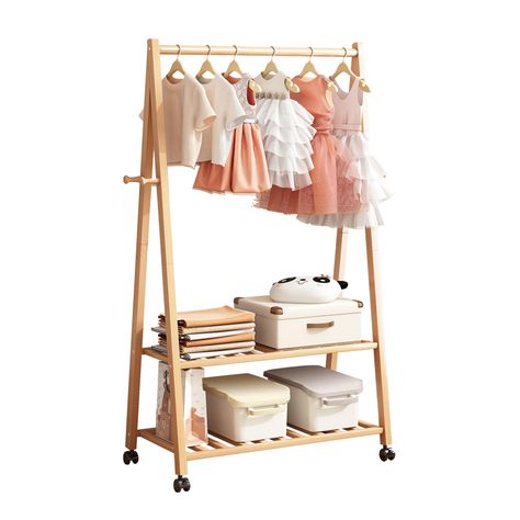 PRICES MAY VARY. Large Storage Capacity: Functionality extends beyond hanging space, The kids clothing rack includes a solid wood hanging rail, equipped with two hooks on both sides of the unit, perfect for hanging a variety of children's apparel. Below, two shelves offer ample space for folded clothes, shoes, and storage boxes. This feature makes the Clothing Rack an ideal companion to kids dressers and chests, providing a comprehensive solution for clothing storage and organisation. Lockable W Dress Up Rack, Toddlers Bedroom, Dress Up Storage, Kids Clothing Rack, Folded Clothes, Kids Dressers, Kids Dress Up, Dress Stand, Toddler Bedrooms