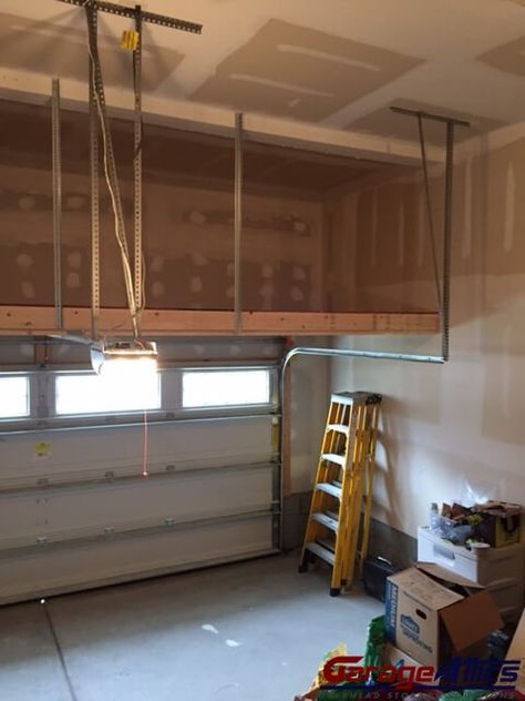 Loft Storage Solutions | Custom Built Massive Overhead Garage Storage Ceiling Mounted Garage Storage, Storage Loft In Garage, High Ceiling Garage Storage Ideas, Garage Loft Storage, Garage Storage Loft, Garage Storage Ceiling, Garage Loft Ideas, Garage Mezzanine, Diy Overhead Garage Storage