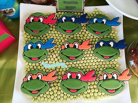 TMNT Birthday Bash! | CatchMyParty.com Teenage Mutant Ninja Turtle Cookies, Tmnt Cookies, Ninja Turtle Cookies, Ninja Turtle Cupcakes, Teenage Mutant Ninja Turtle Cake, Turtle Birthday Parties, Tmnt Birthday, Cartoon Cookie, Ninja Turtles Birthday Party