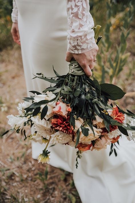 This bridal bouquet is full of dahlias, one of the bride's favorite flowers, and we loved getting to select blooms in the fall earthy tones of oranges and browns for her outdoor fall wedding!  Photo: Der Norden Studded Wedding Dress, Moody Lighting, Fall Wedding Bouquet, Fall Bouquet, Fall Tones, Floral Styling, Styled Wedding Shoot, Styled Wedding Shooting, Outdoor Fall Wedding