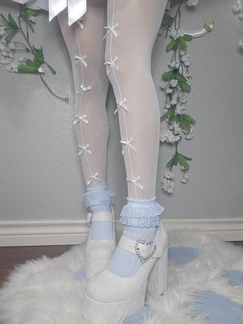 Bow tights coquette aesthetic fashion dollete aesthetic angel core white heels white and baby blue frilly socks Angel Aesthetic Fashion, Dolly Core Outfits, White Aesthetic Accessories, Aesthetic Blue Accessories, Frilly Outfits Aesthetic, Blue And White Clothes Aesthetic, Angel Fashion Aesthetic, Doll Core Aesthetic Outfit, Coquette Core Outfits