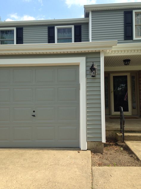 Garage door painted Valspar Gray Exposé 5007-2A at Lowes. Closest paint color to match Certainteed Seagrass siding. Certainteed Sea Grass Vinyl Siding, Certainteed Seagrass Vinyl Siding, Seagrass Siding House, Seagrass Siding, 1970s Exterior, Garage Door Painted, Valspar Gray, Certainteed Vinyl Siding, Modern Exterior Paint Colors