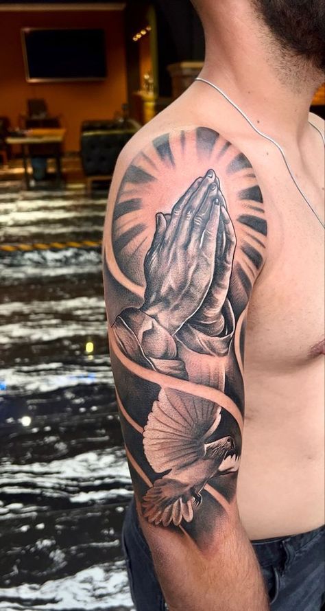 If you have been looking for unusual tattoo designs with praying hands for a long time, then our article is for you. We have collected 55+ of the most interesting and their meanings in human life. Praying Hands Half Sleeve Tattoo, Praying Hands Tattoo Sleeve, Praying Hands Tattoo Shoulder, Half Upper Sleeve Tattoo Men, Upper Hand Tattoo Men, Praying Hand Tattoo Design, Men’s Upper Arm Tattoos, Upper Arms Tattoo, Prayer Tattoo Men