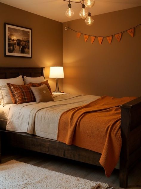 Create a warm and inviting rustic orange accent wall in your bedroom, and complement it with a dark wood bedframe and a cozy plaid throw blanket. Complete the look with vintage Edison bulb string lights for a charming touch. Dark Wood Bedframe, Orange Accent Wall, Orange Accent Walls, Edison Bulb String Lights, Dark Wood Bedroom, Rustic Orange, Plaid Throw Blanket, Bulb String Lights, Vintage Edison Bulbs