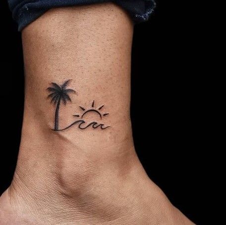 Beautiful Wave and Sun Tattoo on Foot With a Beautiful Palm Tree Palm Tree Tattoo On Thigh, Sun Wave And Palm Tree Tattoo, Sun And Palm Tree Tattoo Small, Palm Tree Inner Arm Tattoo, Beach Wave And Sun Tattoo, Palm Tree And Wave Tattoo Ankle, Palm Tree And Waves Tattoo, Palm Tree Beach Tattoos, Little Palm Tree Tattoo