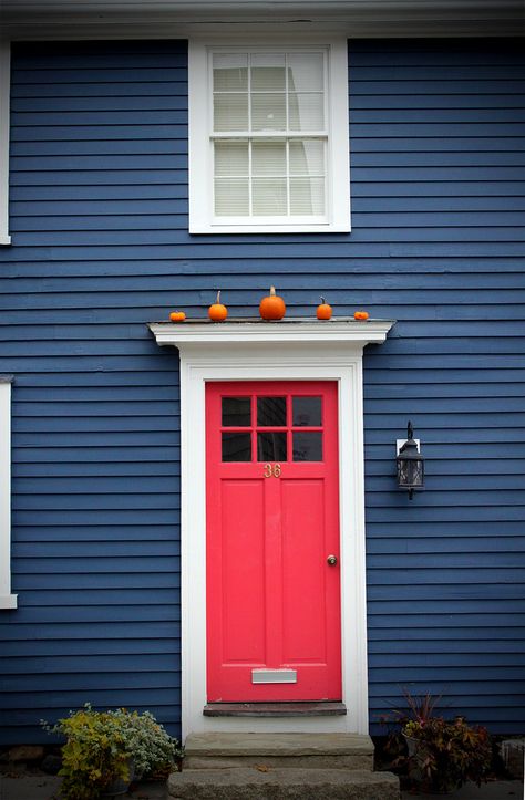 Red Door | Little orange pumpkins above the red door on blue house Navy Blue Houses, Red Door House, House Paint Color Combination, Exterior House Color, Siding Colors, Dark House, Pintura Exterior, Pink Door, Exterior Paint Colors For House