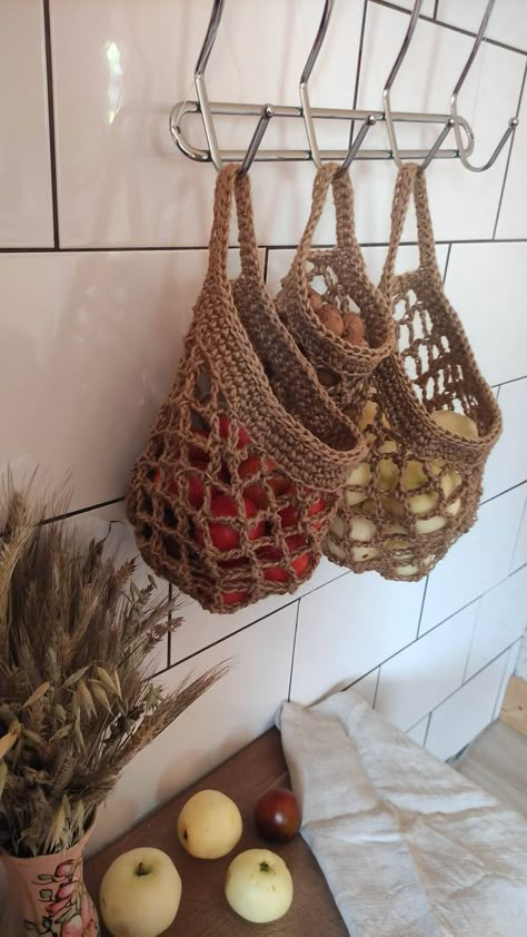 Crochet jute mesh baskets are durable and perfect for eco-friendly storage. Suitable for storing cosmetics and soap in the bathroom and ideal for saving space in the kitchen and storing fruits, vegetables, potatoes, onions, nuts and other products. Handmade baskets can also be used to store toys and other items. Diy Laine, Crochet Jute, Storing Fruit, Potatoes Onions, Fruit Baskets, Crochet Food, Small Basket, Crochet Kitchen, Handmade Baskets