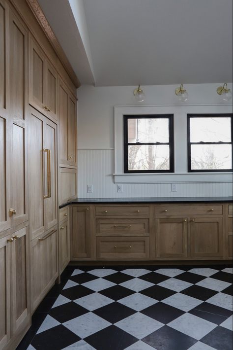 These ready-to-assemble, natural, white oak inset cabinets give this modern-cottage styled kitchen just the right amount of warmth and exudes sophistication! @cabinetjoint #kitchencabinetry #whiteoakcabinets #kitchenideas #harlequin Oak Cabinets Checkered Floor, Checker Board Kitchen Floors, Black And White Checkered Floor Kitchen Wood Cabinets, Harlequin Floor Kitchen, Black And White Tile Kitchen Floor, Black And White Checkered Floor Kitchen, White Oak And Black Kitchen, Black And White Tile Kitchen, Black And White Kitchen Floor