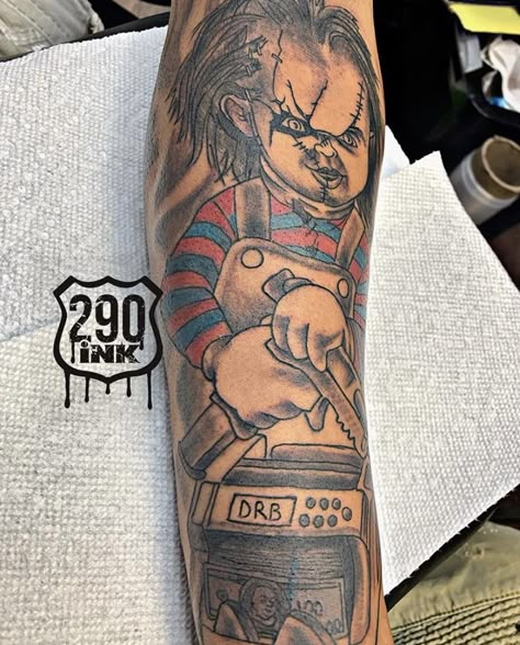 Chucky Gemini Tattoo, Money Counter Tattoo, Chucky Tattoo On Hand, Gangsta Cartoon Characters Tattoos, Chucky Sleeve Tattoo, Money Bag Tattoo On Neck, Hustle Tattoo For Men, Chucky Tattoo Design Black And White, Boondocks Tattoo Designs