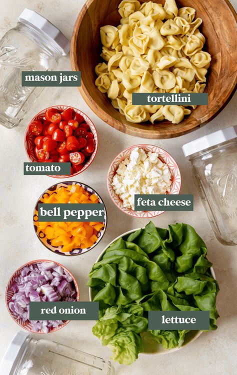 Mason Jar Salads with Tortellini is your new favorite vegetarian lunch in a jar! They are loaded with fresh veggies, homemade salad dressing and cheese tortellini. Perfect for lunches on the go, picnics, back to school or meal prep. #masonjarsalad #lunchinajar #healthysalad #mealprep #backtoschool #easylunches #schoollunch #lunchfortheweek #krollskorner Lunches In A Jar, Tortellini Mason Jar Salad, How To Layer Salad In Mason Jar, Jarred Lunches, Low Carb Mason Jar Salad Recipes, Pasta Salad Jar, Mason Jar Meals Make Ahead, Macro Salad, Mason Jar Lunch Ideas