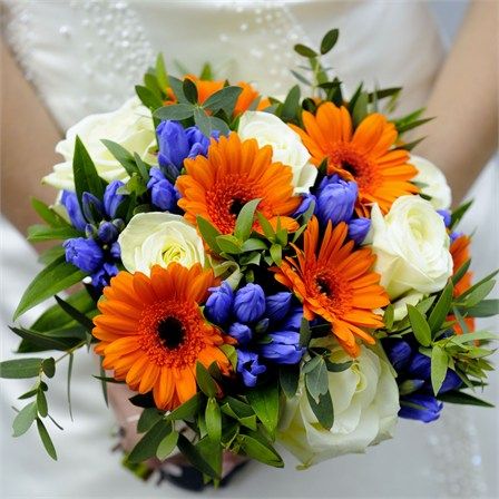 Ebenezers in Shropshire helped Gemma and Adam choose their wedding flowers. Gemma carried a gorgeous bouquet down the aisle which incorporated orange, ivory and blue flowers to match the colours  ... Wedding Bouquets Blue, Red Rose Bridal Bouquet, Red Bridal Bouquet, Orange Bouquets, Orange Wedding Flowers, Blue Wedding Bouquet, Red Rose Bouquet, Blue Wedding Flowers, Prom Flowers