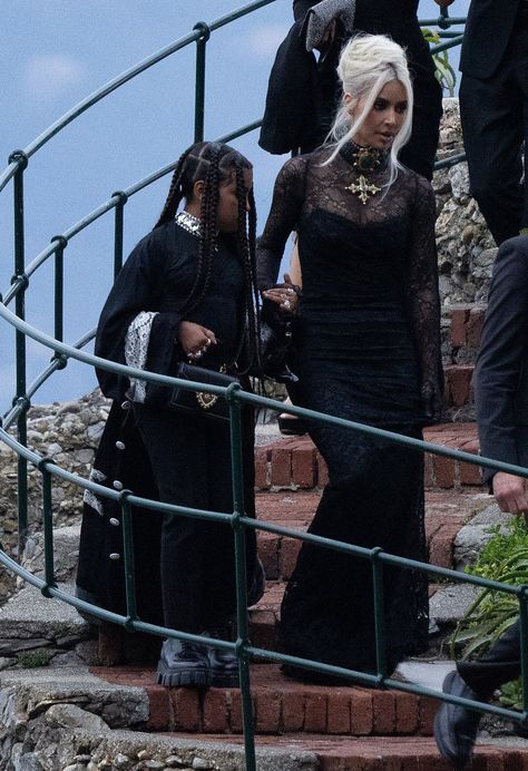 Kim Kardashian Photos on Twitter: "Kim and North arriving at Kourtney and Travis’ wedding in Italy today.… " Kourtney Wedding, Kourtney And Travis, Kardashians Jenner, Kim And North, Woman Singing, Dark Suit, Kardashian Kids, Wedding In Italy, Gothic Looks