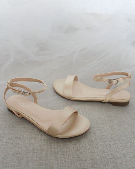 Classy satin flat sandals with ankle strap. Effortless yet adorable to wear on your favorite occasion. Can be pair with dress or casual look.DETAILS:COLORS AVAILABLE: Ivory, White, Pink, Light Blue, and ChampagneUPPER: Synthetic upper and liningMATERIALS: Mandmade outsoleSTYLE NAME: MADDY Champagne Shoes Wedding, Prom Flats, Bridesmaid Shoes Flat, Dressy Flat Sandals, Flat Prom Shoes, Bridesmaid Flats, Bridesmaid Sandals, Cream Flats, Nude Flats