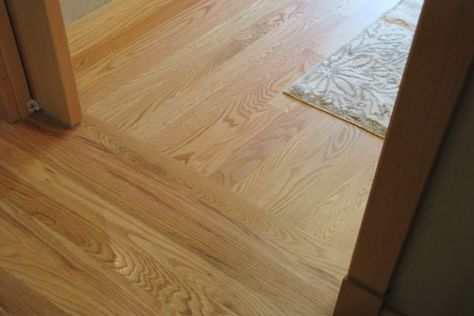 How to Properly Execute Flooring Transitions - Builders Surplus Flooring Direction, Hardwood In Kitchen, Best Wood Flooring, Floor Transition, Laminate Hardwood Flooring, Wood Floor Installation, Transition Flooring, Room To Room, Porcelain Wood Tile