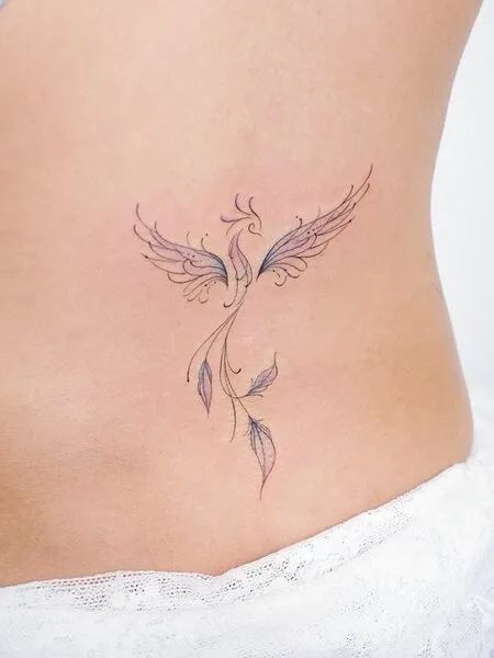 However, most phoenix tattoos are in vibrant colors, daring, and expressive. And sometimes they can be too overwhelming for girls. But with creativity, you can make a phoenix tattoo classy and elegant. Small watercolor phoenix on the shoulder blade Unlike vibrant, solid coloring you can see in traditional tattoos, watercolors are a subtle way to add just enough glam to the tattoo. #tattoo #tattoodesign #tattooing # tattoo ideas # phoenix tattoo ideas # phoenix tattoo ideas small Phoenix Tiny Tattoo, Strength Feminine Tattoo, Phoenix Small Tattoo For Women, Behind The Ear Phoenix Tattoo, Pheonix Tattoo Tiny, Womens Phoenix Tattoo, Love Nature Tattoo, Pretty Phoenix Tattoo, Mother Of 6 Tattoo Ideas