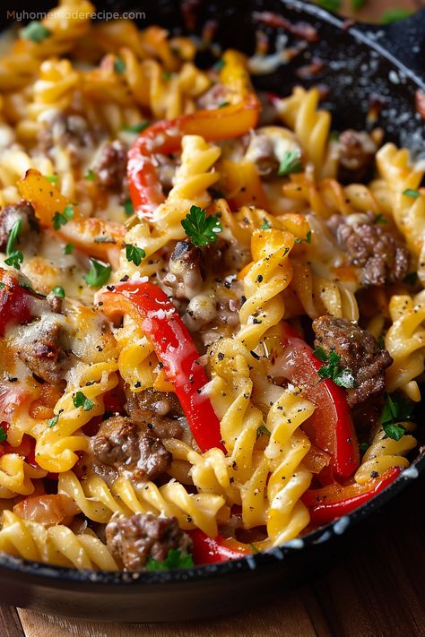 This Philly Cheesesteak Pasta Skillet combines the heartiness of Philly's favorite sandwich with the comforting embrace of pasta, all melded together in a dish that's sure to become a new family favorite. Cheesesteak Pasta Skillet, Steak Tips And Pasta, On The Go Dinners Families, Skillets For Dinner, Recipes Using Philly Steak Meat, Philly Cheese Steak Pasta Skillet, Steak Bites Pasta, Easy Dinner Ideas Using Ground Beef, Beef With Pasta Recipes