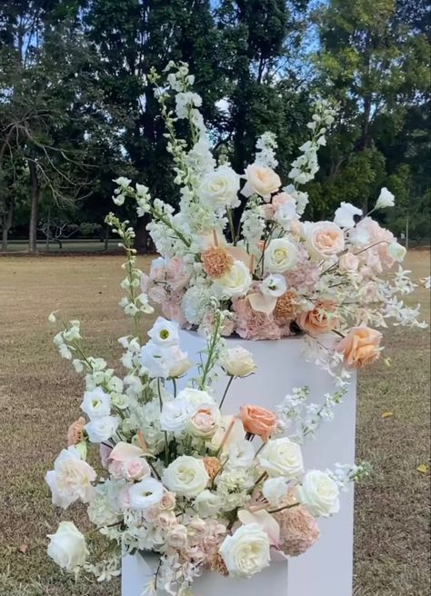 Pink And White Ceremony Flowers, Wedding Ceremony Podium Flowers, Pastel Flower Arrangements Wedding Ideas, White Green And Peach Wedding Flowers, White Blush Peach Wedding Flowers, Wedding Ceremony Pillar Flowers, Ceremony Flower Pillars, Wedding Neutral Flowers, Ceremony Pedestal Arrangements