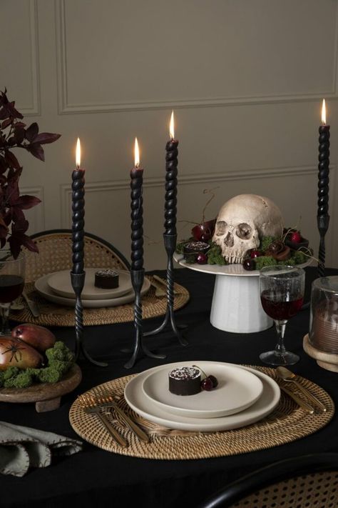 Playfully spooky dining room table decor in darker color palette and with layers of texture. Moody colors, like burgundy and black, complement the earthy browns and greens, then a touch of gold for high contrast. Spooky Table Decor, Halloween Dinner Table Decor, Styled Shelf, Darkly Inclined, Peace Aesthetic, Halloween Dinner Party, Minimalist Halloween, Halloween Tablescape, Halloween Party Dinner