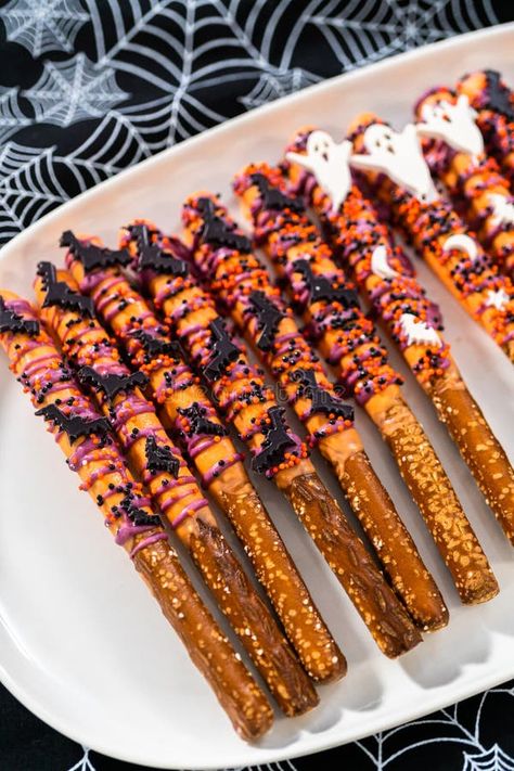 Halloween chocolate-covered pretzel rods royalty free stock photo Fall Pretzel Rods, Chocolate Covered Pretzels Halloween, Decorated Pretzels, Halloween Pretzels, Chocolate Covered Pretzel Rods, Chocolate Dipped Pretzels, Pretzel Dip, Pretzel Rods, Halloween Chocolate