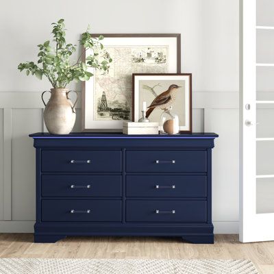 This 6-drawer dresser combines classic style with convenient LED lighting. It's built from solid and engineered wood with a neutral finish, and it has a horizontal rectangular silhouette. This dresser stands on decorative bracket feet, and it features beveled edges complete with built-in LED lighting that illuminates your choices while you select an outfit. Each dovetailed drawer rolls open on metal ball-bearing glides to provide easy access to your clothing and accessories, and they're accented Blue Dresser Bedroom, Navy Blue Dresser, Blue Bedroom Furniture, Blue Dresser, Decorative Brackets, Double Dresser, 6 Drawer Dresser, Metal Ball, Metal Drawers