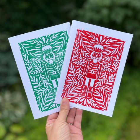 This block print nutcracker Christmas card is printed on matte cardstock and measures 5"x7" when folded. Each card is hand stamped with a hand carved block, each one perfectly imperfect and unique! It is available in red or green, in packs of 1, 5 or 10. It comes with a white envelope packaged in a poly sleeve for protection. This card is blank inside. Shipping is for untracked letter mail. Thank you for visiting my shop :) Nutcracker Linocut, Lino Christmas Cards Linocut Prints, Block Print Christmas Card, Nutcracker Card, Nutcracker Christmas Card, Christmas Card Illustration, Print Christmas Card, Wife Gifts, Diy Christmas Cards