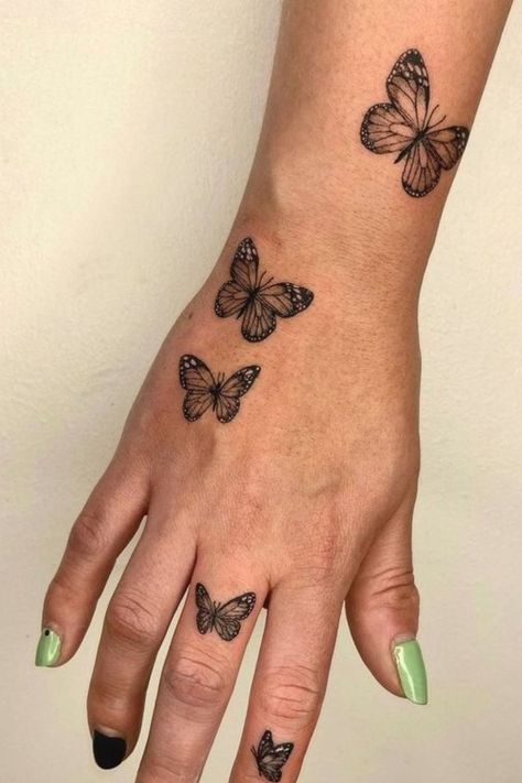 Top 23 Butterfly Hand Tattoo Ideas To Embrace Elegance Cute Butterfly Tattoos, Tattoos On Arm, Simple Butterfly Tattoo, Butterfly Tattoos On Arm, Butterfly Hand Tattoo, Unique Butterfly Tattoos, Butterfly Tattoo Meaning, Small Butterfly Tattoo, Pretty Hand Tattoos