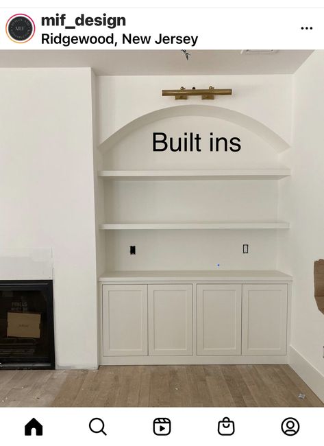 Living Room Wall Units Built Ins, Large Built In Entertainment Center, Asymmetrical Fireplace Built Ins, Shelving By Fireplace, Arched Built Ins Fireplace, Arch Built In Shelves, Fireplace Cabinets On Each Side, White Oak Living Room, Long Tv Wall