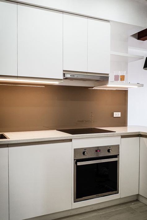 Finished kitchen with white solid surface countertop and back-painted glass splashboard. #flipspace #flipspacestudio #flipshop #architecture #interiordesign #construction #renovation #residentialph #manila #binondo #orchardresidences #condo #kitchen #splashboard Splashboard Kitchen, Solid Surface Countertop, Back Painted Glass, Condo Kitchen, Wall Kitchen, Glass Board, Trendy Kitchen, White Solid, Painted Glass