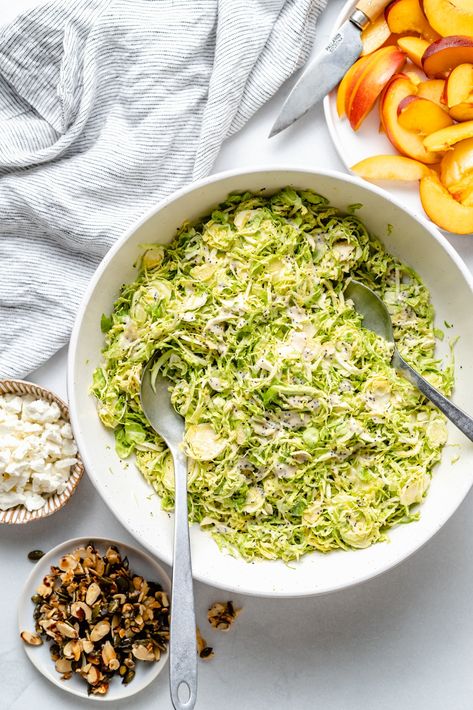 Gorgeous peach brussels sprouts salad with sweet & salty nuts and a creamy tahini poppy seed dressing. This vegetarian brussels sprouts peach salad is filled with a wonderful mix of textures and flavors. Enjoy it for the perfect summer lunch or side dish on its own or with your favorite protein! #peaches #brusselssprouts #salad #vegetarian #healthylunch Spicy Nuts, Lemon Garlic Salmon, Crunch Salad, Brussels Sprouts Salad, Salad Vegetarian, Summer Salads With Fruit, Poppy Seed Dressing, Shredded Brussel Sprouts, Ambitious Kitchen