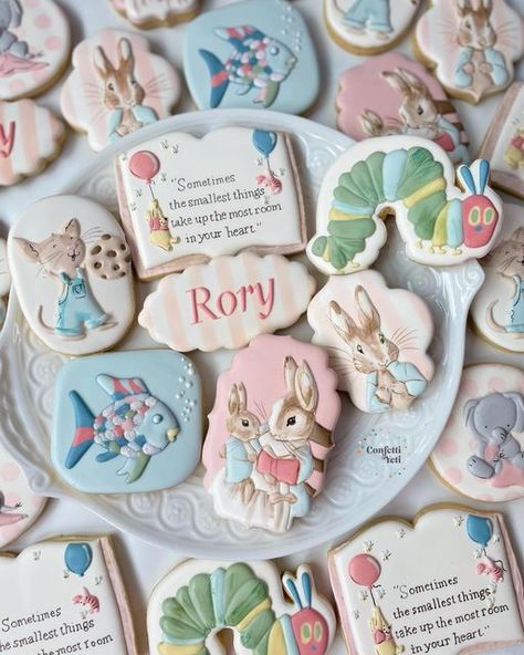 Kerstyn Lott on Instagram: "I love a nursery book theme for baby showers. I still remember falling in love with characters, and learning life lessons from them.  We did many of the classics in soft pastels for sweet little Rory on the way. Peter Rabbit, Winnie the Pooh, Rainbow Fish, The Hungry Caterpillar, and If You Give A Mouse A Cookie; and also a cute little elephant for the Alabama mama.  #babyshowercookies #bookcookies #bookbabyshower #peterrabbitcookies #winniethepoohcookies #confettiyeticookies" If You Give A Mouse A Cookie Baby Shower Theme, Storybook Baby Shower Cookies, Book Baby Shower Cookies, Nursery Rhyme Baby Shower Theme, Storybook Cookies, Rabbit Winnie The Pooh, The Hungry Caterpillar, Book Shower, Bebe Shower