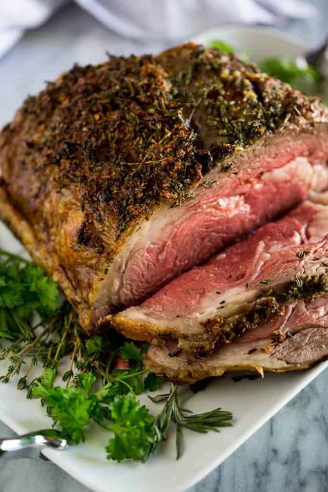 A slow roasted Prime Rib recipe, seasoned with garlic and herbs, with step by step instructions and tips for making perfect boneless or bone-in prime rib. Best Prime Rib Recipe, Cooking Prime Rib Roast, Jus Recipe, Slow Roasted Prime Rib, Au Jus Recipe, Prime Rib Roast Recipe, Perfect Prime Rib, Cooking Prime Rib, Rib Roast Recipe