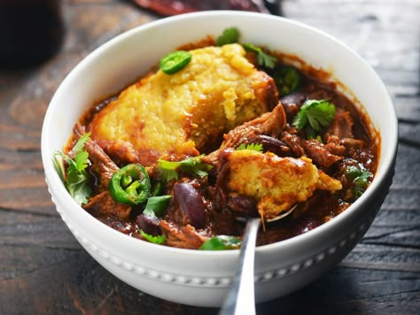 For a meal that's perfect for Football Sundays or chilly-evening dinners, make this chili right in your slow cooker. It's not your traditional beef-based recipe, but pulled pork shoulder and tender cornbread dumplings make this version stand out among the rest.\n\n Pork Shoulder Chili, Cornbread Dumplings, Chili With Cornbread, Pulled Pork Chili, Favorite Chili Recipe, Pork Chili, With Cornbread, Chili And Cornbread, Boneless Pork Shoulder