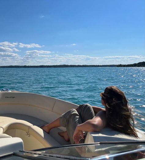 a girl is seated in a speedboat. she looks out over the water. Sleeping On A Boat, Speed Boat Photoshoot, Speedboat Aesthetic, Speed Boat Aesthetic, Boating Aesthetic, Sailing Aesthetic, Boat Photoshoot, African Couture, Yatch Boat