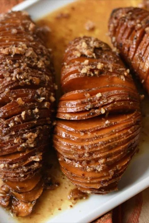 This easy Hasselback Sweet Potatoes recipe is made with maple syrup and pecans. Simple to make for Thanksgiving dinner as an alternative to sweet potato casserole. It may look fancy, but it's a quick-to-prep Southern side dish. Hasselback Sweet Potato, Simple Thanksgiving Dinner, Thanksgiving Dinner Sides, Hasselback Sweet Potatoes, Easy Thanksgiving Dinner, Southern Side Dishes, Flavored Butter, Dinner Side Dishes, Delicious Vegetables