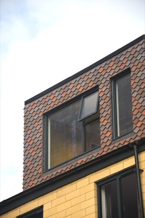 A dormer roof extension featuring vertical arrowhead hanging tiles in a bled of brown heather, bronze and dark heather colours Dormer Roof Extension, Rendered Dormer, Dormer Exterior, Dormer Extension, Loft Extensions, Roof Addition, Loft Dormer, Arrowhead Pattern, Loft Conversion Plans