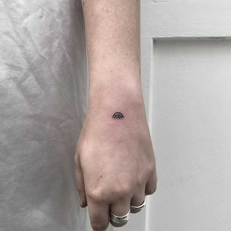 A minimalist black rainbow tattooed on the left hand by Rich Sinner Rainbow Tattoo Ideas Black And White, Black Rainbow Tattoo, Rainbow Tattoo Ideas, Rainbow Tattoo, Minimalist Rainbow, Rainbow Tattoos, Saved Tattoo, Cloud Tattoo, Flower Tattoo Shoulder