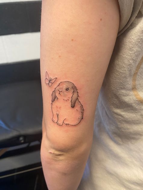 lop eared bunny tattoo with a butterfly Bunny With Halo Tattoo, Floppy Eared Bunny Tattoo, Whimsical Bunny Tattoo, Bunny And Butterfly Tattoo, Lionhead Rabbit Tattoo, Bunny With Flowers Tattoo, Mini Lop Bunny Tattoo, Lop Eared Bunny Tattoo, Lionhead Bunny Tattoo