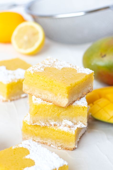 Tart Lemon Mango Bars // Perfectly tart and sweet mango bars with a shortbread cookie crust are the perfect way to celebrate the summer and bring for parties and potluck snacks! Make with fresh mango puree and lemon juice, they're sweet with the perfect amount of bite #mango #fruitbars #shortbread #summertreat #summerrecipes #summerdessert Lemon Coconut Bars, Lemon Square, Homemade Lemon Bars, Easy Lemon Bars, Mango Bars, Ckd Recipes, Dessert Lemon, Mango Desserts, Classic Lemon Bars