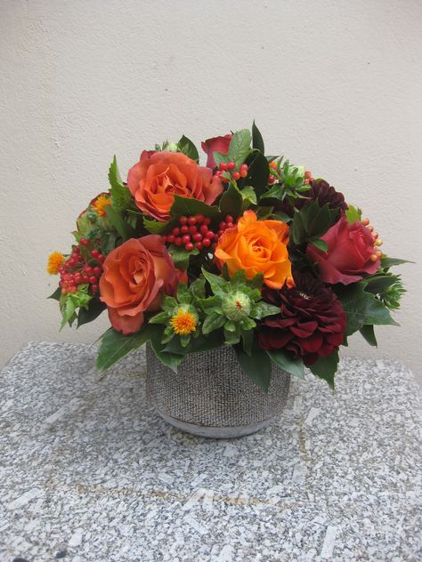 autumnal flower arrangement of orange roses, red dahlias and viburnum berries  by Judith Blacklock Orange Rose Flower Arrangements, Spanish Style Flower Arrangements, Red Orange Flower Arrangements, Red And Orange Flower Arrangements, Thanksgiving Flower Arrangements, Viburnum Berries, Red Dahlias, Thanksgiving Floral Arrangements, Thanksgiving Flowers