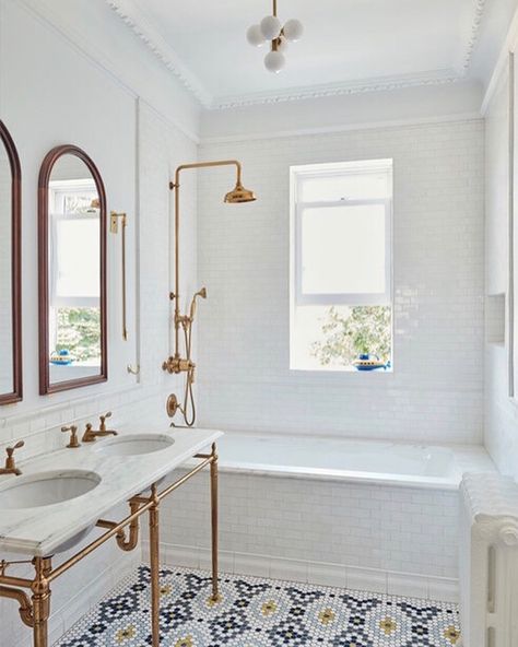 Complete with pedestal sinks, clawfoot tubs, and square subway tile walls, these 14 retro bathrooms are proof that modern isn't always best. Bathroom Shower With Window Ideas, Subway Tile And Beadboard Bathroom, Bathtub With Pony Wall, Modern 1920s Bathroom, Floor To Ceiling Subway Tile Bathroom, Shower Over Bath Small Bathroom, Funky Tile Bathroom, Tiled In Bath, Narrow Primary Bathroom