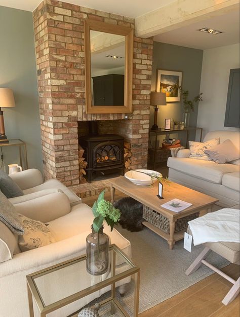 Brick Slip Living Room, Small Brick Fireplace, Logs And Fairy Lights In Fireplace, Log Burner Living Room Brick, Brick Slip Log Burner, Brick Fireplace Living Room, Exposed Brick Log Burner, Cottage Log Burner, Small Cottage Living Room