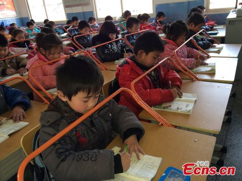 Chinese Grit, Folly.... Grit: firmness of character; indomitable spirit. indomitable courage, toughness, or resolution. Folly: Lack of good sense; foolishness. A foolish act, idea, or practice: ..............................Students use new desks, installed with railings, to prevent nearsightedness at Zhanglin Primary School in Xinzhou district of Wuhan, central China's Hubei province as the new semester just began. Classroom Desk, Unusual Pictures, School Desks, Student Desks, Study Habits, Poor Children, Interesting Information, Rich Kids, Chinese Culture